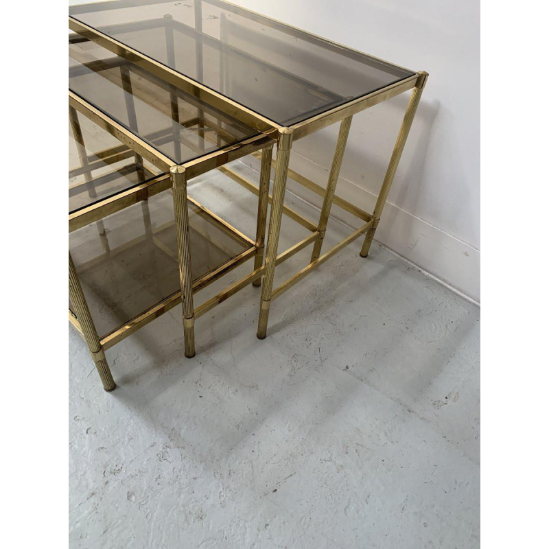 Set of three vintage nesting tables in brass and smoked glass, 20th century