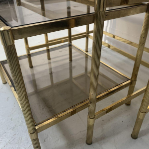 Set of three vintage nesting tables in brass and smoked glass, 20th century