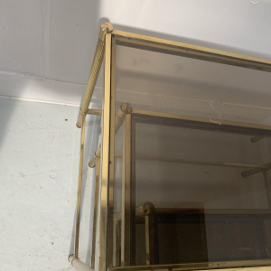 Set of three vintage nesting tables in brass and smoked glass, 20th century