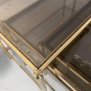 Set of three vintage nesting tables in brass and smoked glass, 20th century
