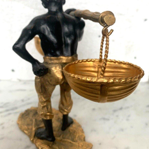Bronze sculpture with a double patina, "African Man Carrying a Basket Balancing Act," 20th century