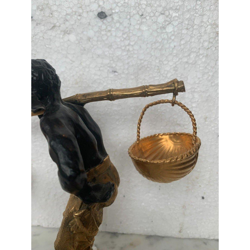 Bronze sculpture with a double patina, "African Man Carrying a Basket Balancing Act," 20th century