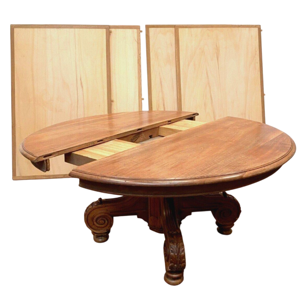 Grande table Napoléon III à allonges, piètement central en noyer massif, XIX siècle