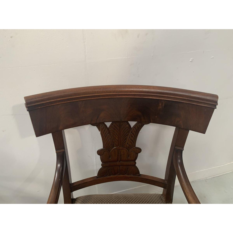 Pair of mahogany armchairs with curved backs decorated with palmettes, 19th century