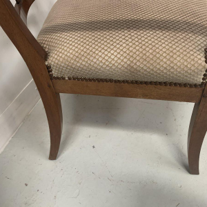 Pair of mahogany armchairs with curved backs decorated with palmettes, 19th century