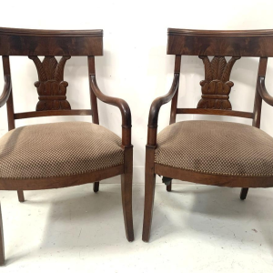 Pair of mahogany armchairs with curved backs decorated with palmettes, 19th century