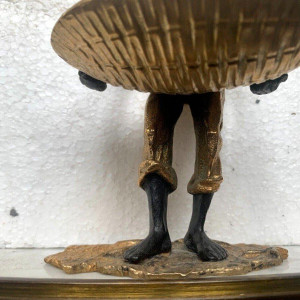 "The Man with the Woven Basket," bronze sculpture with a double patina, 20th century