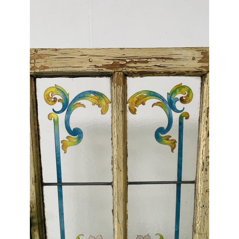 Deur in art-decostijl van gepatineerd vurenhout en beschilderd glas.