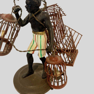 "The Birdcage Carrier," miniature bronze sculpture, 20th century