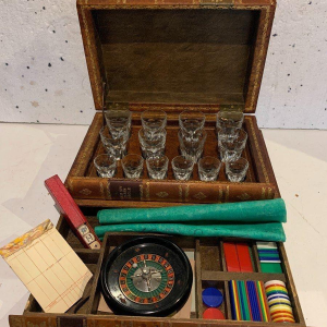 Liquor cabinet and games box disguised as antique books – 20th century