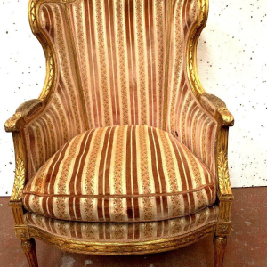 Bergère à coussin de style Louis XVI en bois doré, XXᵉ siècle
