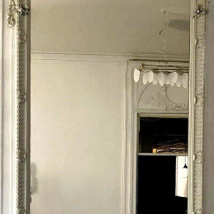 Louis XVI style mirror in carved wood, 20th century