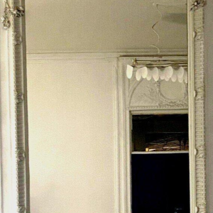 Louis XVI style mirror in carved wood, 20th century