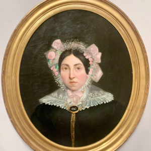 Pair of ancestral portraits, oil on canvas in gilt oval frames, 19th century