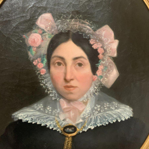 Pair of ancestral portraits, oil on canvas in gilt oval frames, 19th century