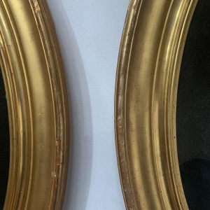 Pair of ancestral portraits, oil on canvas in gilt oval frames, 19th century