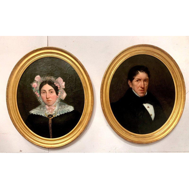 Pair of ancestral portraits, oil on canvas in gilt oval frames, 19th century
