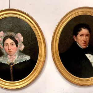 Pair of ancestral portraits, oil on canvas in gilt oval frames, 19th century