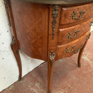 A Louis XV style half-moon commode on legs, in marquetry with a cube background, 20th century