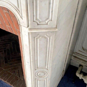 Louis XV style fireplace, Pompadour model, in white Carrara marble, 20th century