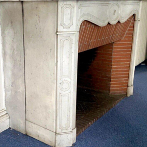 Louis XV style fireplace, Pompadour model, in white Carrara marble, 20th century