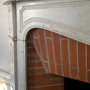 Louis XV style fireplace, Pompadour model, in white Carrara marble, 20th century