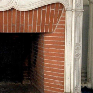 Louis XV style fireplace, Pompadour model, in white Carrara marble, 20th century