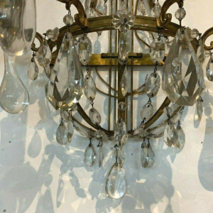 Pair of basket-shaped wall sconces, in bronze and with crystal drops, 20th century