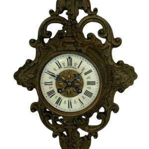GAILLIAU – NEUT, horloge cartel d’applique, bronze ciselé à décor de mascaron, XIX siècle