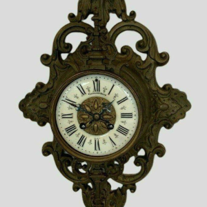 GAILLIAU – NEUT, wall-mounted cartel clock, chased bronze with mascaron decoration, 19th century