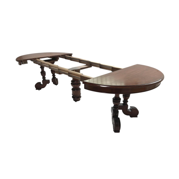 Tafel in Napoleon III-stijl, vervaardigd uit massief mahoniehout, met centrale voet en verlengstukken, 19e eeuw.
