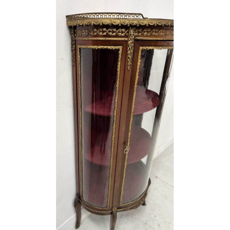 A curved display cabinet in the Napoleon III style, made of mahogany and veneer, 20th century