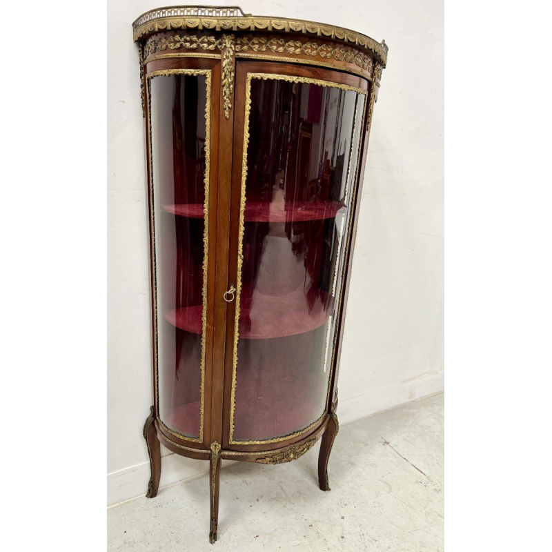 A curved display cabinet in the Napoleon III style, made of mahogany and veneer, 20th century