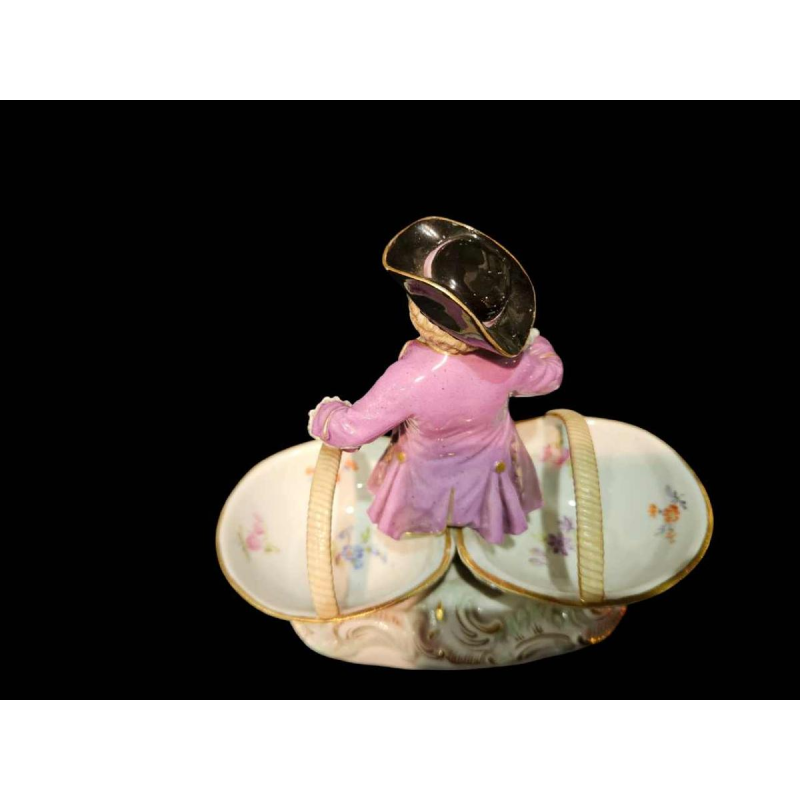 Meissen porcelain 'Child with baskets' polychrome salt shaker statuette, 19th century