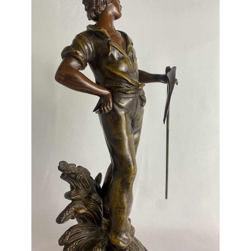 Auguste Moreau Farmer with a scythe sculpture in regula with green patina, ca 1900