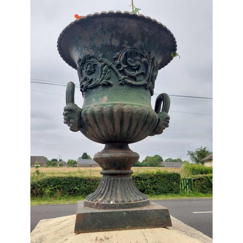 Pair of large cast iron urns, planters
