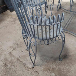 Blue wrought iron garden furniture in the Cap d'Ail style, 6 scrolled armchairs and 1 table, ca 1950