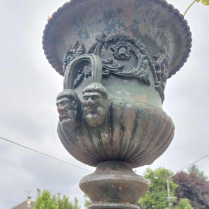 Pair of large cast iron urns, planters