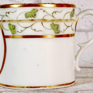 Paris porcelain, cup and saucer with rebus decoration, 18th c