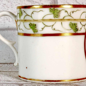 Paris porcelain, cup and saucer with rebus decoration, 18th c