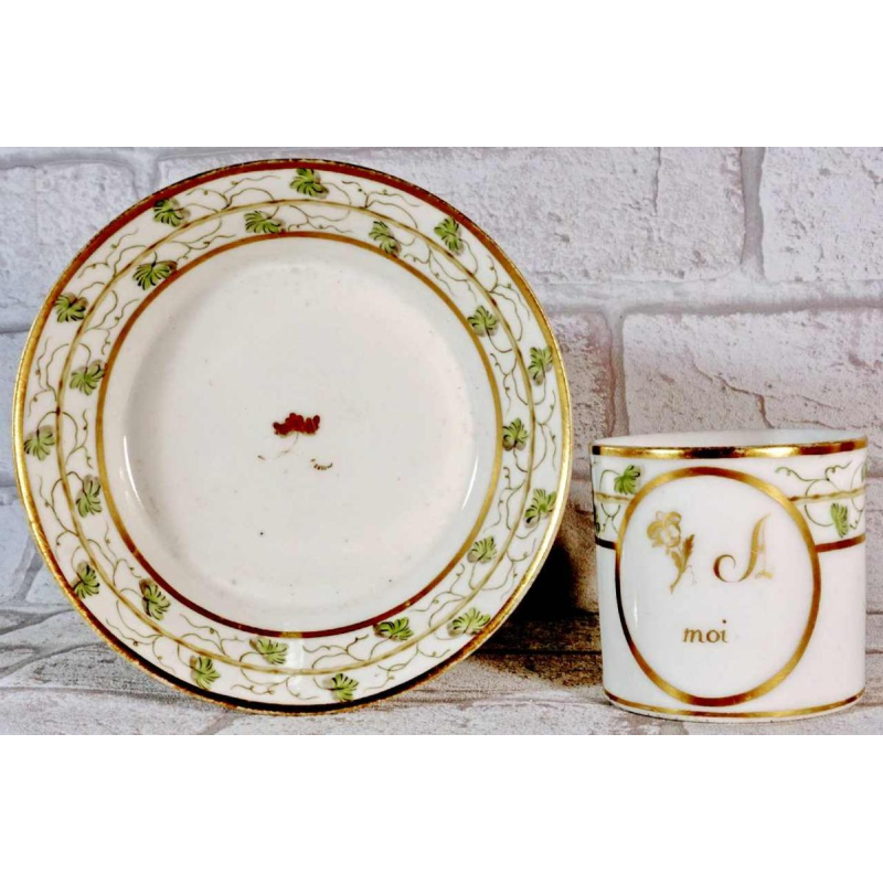 Paris porcelain, cup and saucer with rebus decoration, 18th c