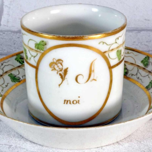 Paris porcelain, cup and saucer with rebus decoration, 18th c