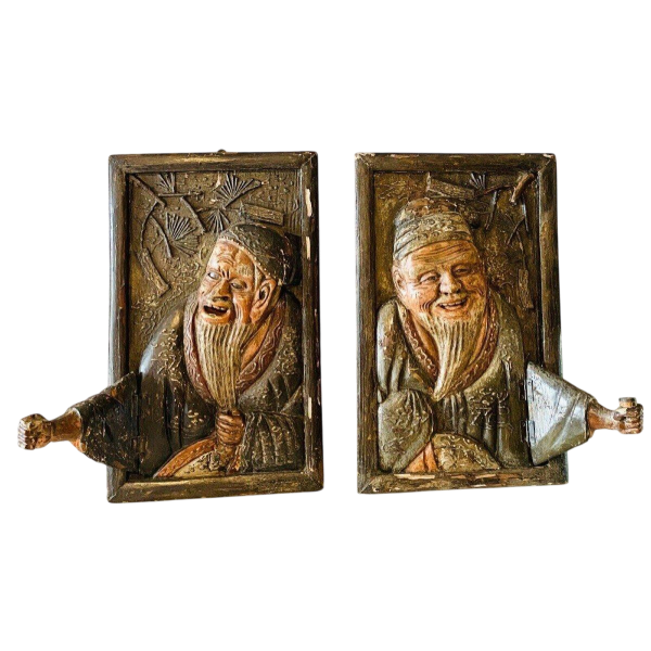 Pair of carved wooden wall sconces decorated with Chinese figures, 20th century