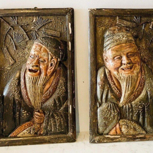 Pair of carved wooden wall sconces decorated with Chinese figures, 20th century