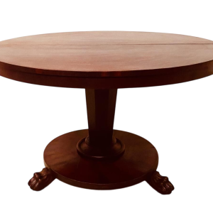 Round Empire mahogany side table with a central four-legged "lion's paw" base, 19th century