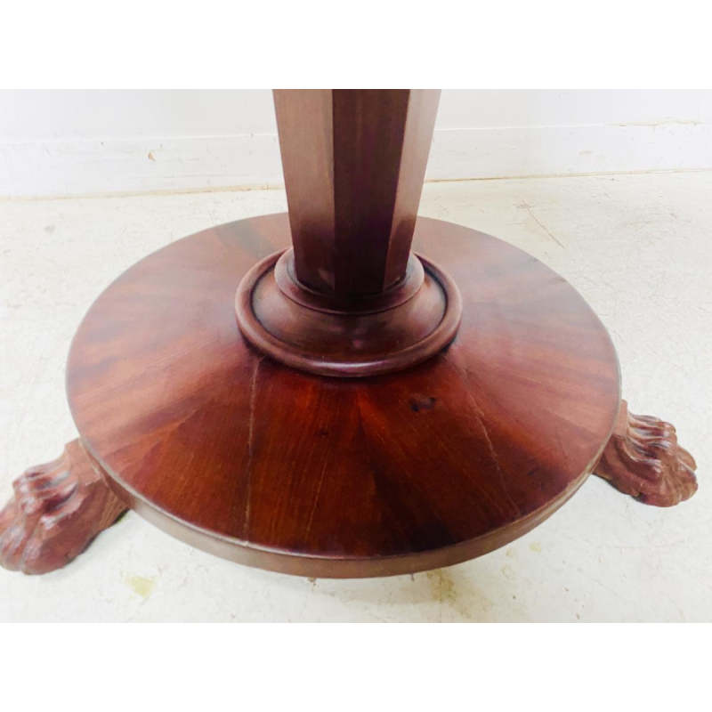 Round Empire mahogany side table with a central four-legged "lion's paw" base, 19th century