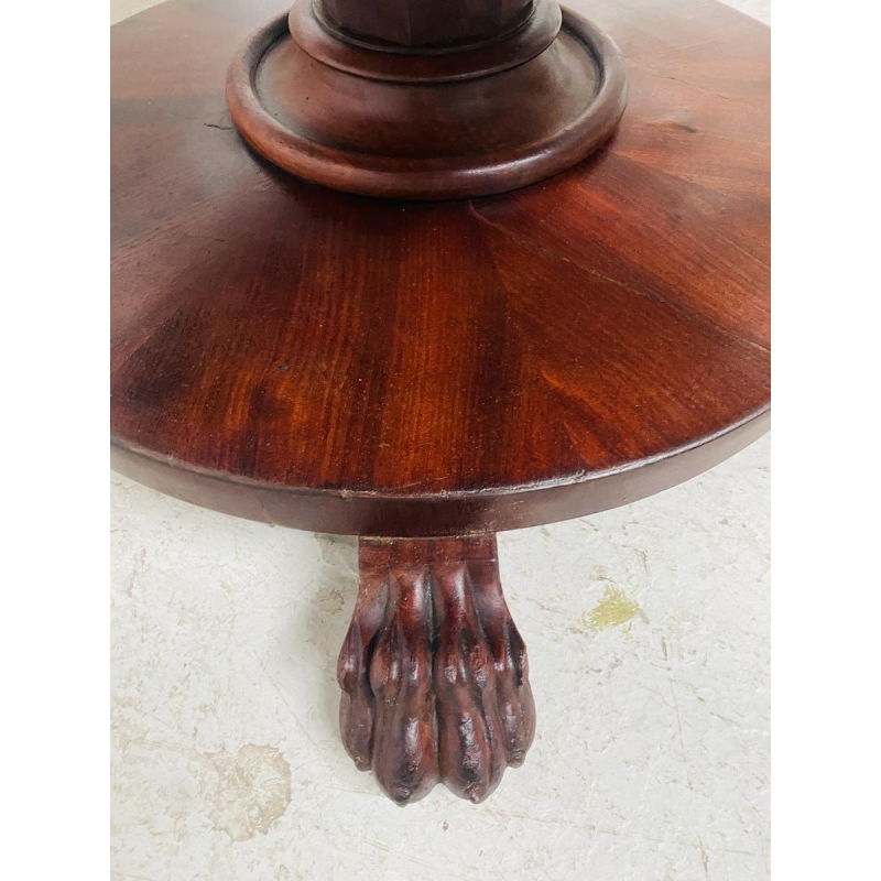 Round Empire mahogany side table with a central four-legged "lion's paw" base, 19th century