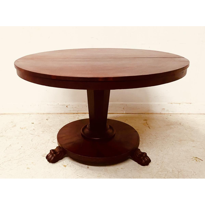 Round Empire mahogany side table with a central four-legged "lion's paw" base, 19th century