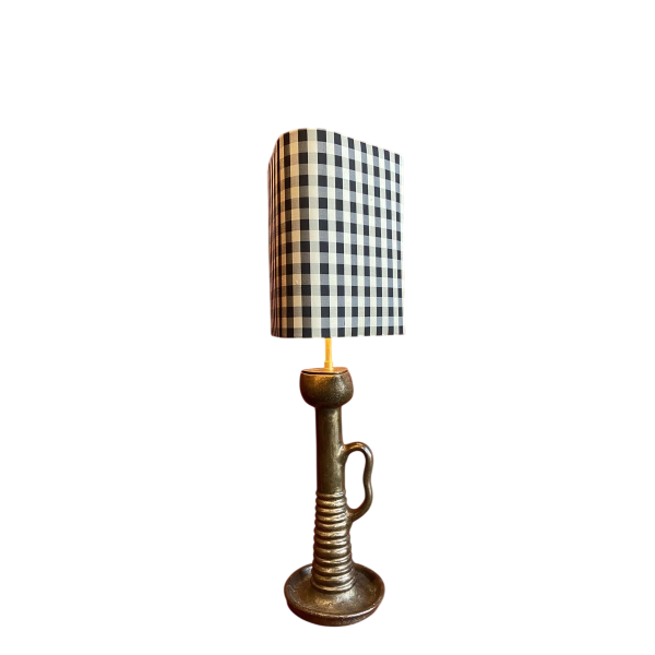 Bronze table lamp with a black and white checkered silk lampshade