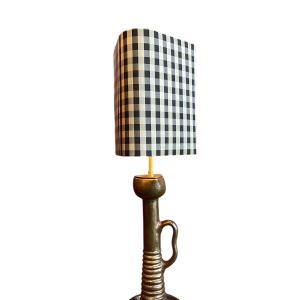 Bronze table lamp with a black and white checkered silk lampshade